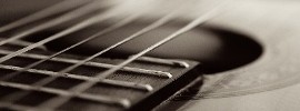 Close up of guitar and guitar strings
